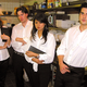 Four members of the Manilla Grill waitstaff.